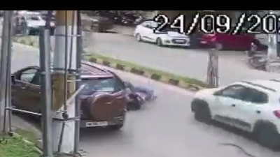 In CCTV footage, within seconds, the woman crashed on the road and an SUV car ran over her which was going on the same road. In CCTV footage, within seconds, the woman crashed on the road and an SUV car ran over her which was going on the same road.