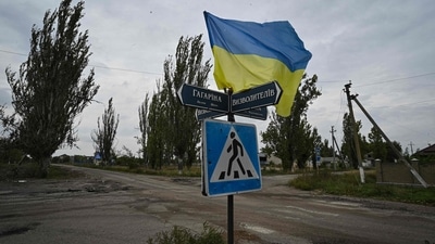 Russia-Ukraine War: Ukrainian flag waves on a street of the recently liberated village of Vysokopillya, Kherson region. (AFP)