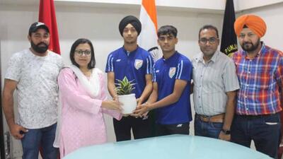 Deputy commissioner Surabhi Malik honouring Indian National U-17 Football team players Gurnaz Singh Grewal and Balkaran Singh at her office in Ludhiana. (HT PHOTO)
