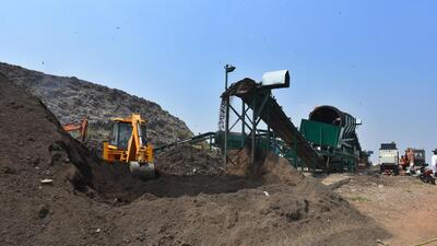 New Delhi, India - Sept. 11, 2020: A newly inaugurated trommel machine at work inside the dump yard, at Ghazipur, in New Delhi, India, on Friday, September 10, 2020. The garbage accumulation is said to have gone down by 40ft in a year after the East Delhi Municipal Corporation began using trommel machine-cum-ballistic separators to treat the garbage. (Photo by Raj K Raj/ Hindustan Times) (Raj K Raj/HT PHOTO) New Delhi, India - Sept. 11, 2020: A newly inaugurated trommel machine at work inside the dump yard, at Ghazipur, in New Delhi, India, on Friday, September 10, 2020. The garbage accumulation is said to have gone down by 40ft in a year after the East Delhi Municipal Corporation began using trommel machine-cum-ballistic separators to treat the garbage. (Photo by Raj K Raj/ Hindustan Times) (Raj K Raj/HT PHOTO)