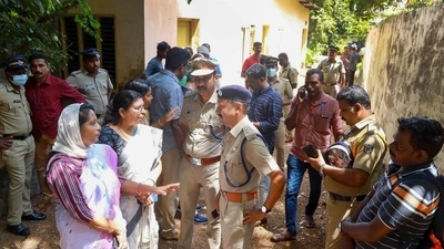 Kochi Police and locals at the place where two women were allegedly murdered and buried in a case of black magic and human sacrifice at Elanthoor in Pathanamthitta district of Kerala on Tuesday (PTI) Kochi Police and locals at the place where two women were allegedly murdered and buried in a case of black magic and human sacrifice at Elanthoor in Pathanamthitta district of Kerala on Tuesday (PTI)