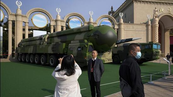 Chinese military vehicles carrying the Dong Feng 41 and DF-17 ballistic missiles are at an exhibition highlighting President Xi Jinping and China’s achievements under his leadership in Beijing, on Wednesday. (AP)