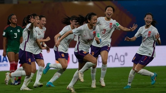 China's Qiao Ruiqi celebrates along with her team members after scoring a goal against Mexico(AP)