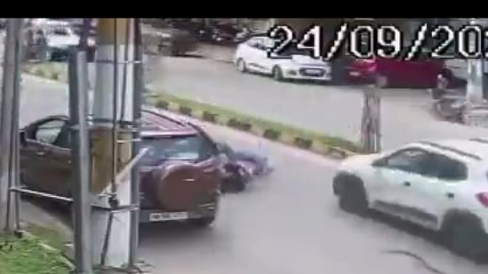 In CCTV footage, within seconds, the woman crashed on the road and an SUV car ran over her which was going on the same road.