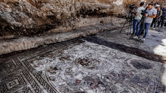 This picture shows a view of a mosaic floor dating to the Roman era being excavated in the city of al-Rastan in Syria's west-central province of Homs.(AFP)