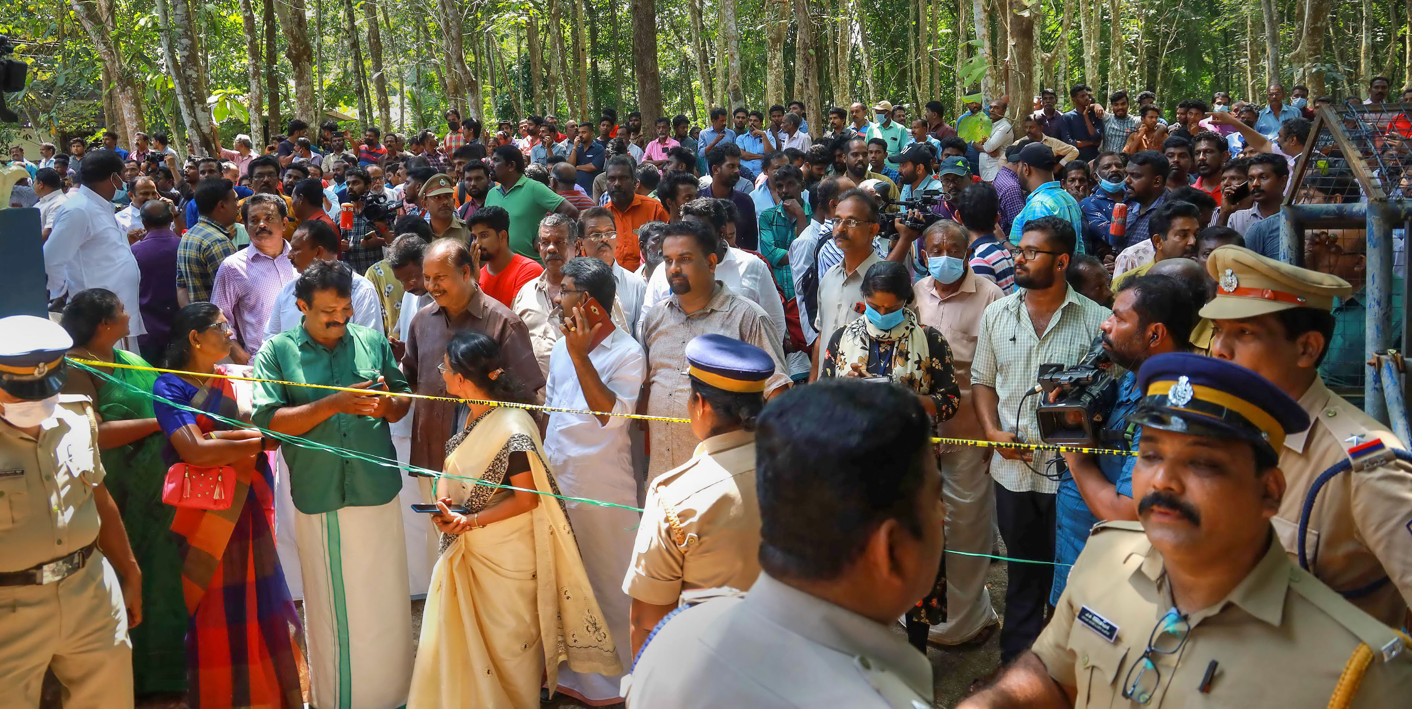 Police and locals at the place where two women were murdered and buried in a horrific case of black magic and human sacrifice at Elanthoor in Pathanamthitta district. (PTI) Police and locals at the place where two women were murdered and buried in a horrific case of black magic and human sacrifice at Elanthoor in Pathanamthitta district. (PTI)