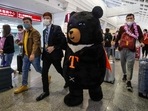 A mascot and an official (centre L) welcome a group of passengers from Thailand at Taoyuan International Airport in Taoyuan on October 13, 2022, after Taiwan reopened its borders by ending mandatory Covid quarantine for arrivals. (Photo by Daniel CENG / AFP) A mascot and an official (centre L) welcome a group of passengers from Thailand at Taoyuan International Airport in Taoyuan on October 13, 2022, after Taiwan reopened its borders by ending mandatory Covid quarantine for arrivals. (Photo by Daniel CENG / AFP)