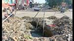 A road cavity at Khazana Market crossing in Ashiana. (HT Photo) A road cavity at Khazana Market crossing in Ashiana. (HT Photo)