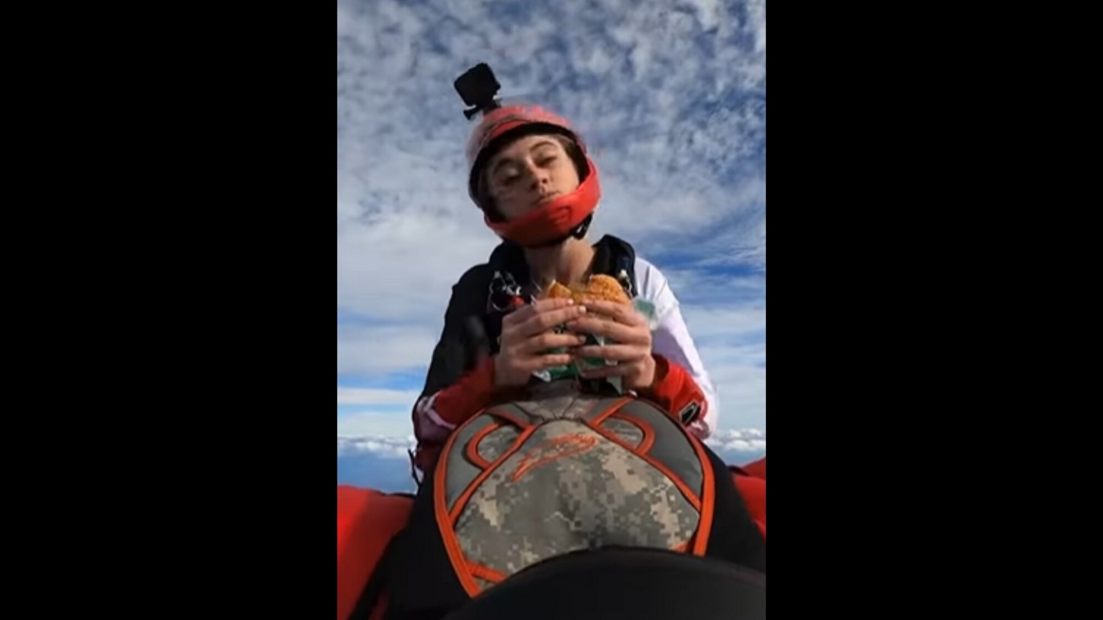 Woman eats burger mid-air while skydiving; stuns the internet - Hindustan Times