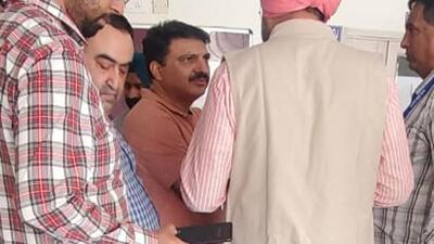Girish Verma (centre), former executive officer (EO) of the Zirakpur municipal council, who was arrested for amassing huge wealth beyond his disclosed sources of his income, was produced in court on Thursday. (HT Photo) Girish Verma (centre), former executive officer (EO) of the Zirakpur municipal council, who was arrested for amassing huge wealth beyond his disclosed sources of his income, was produced in court on Thursday. (HT Photo)