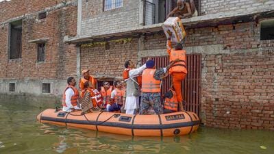 Prayagraj: Deputy Chief Minister of Uttar Pradesh Keshav Prasad Maurya distributes food packets and flood relief material to flood affected people in a residential colony as the water level of the Ganga and Yamuna rivers continues to stay high in the ongoing monsoon season, in Prayagraj, Tuesday, August 30, 2022. (PTI Photo) (PTI08_30_2022_000205A) (PTI) Prayagraj: Deputy Chief Minister of Uttar Pradesh Keshav Prasad Maurya distributes food packets and flood relief material to flood affected people in a residential colony as the water level of the Ganga and Yamuna rivers continues to stay high in the ongoing monsoon season, in Prayagraj, Tuesday, August 30, 2022. (PTI Photo) (PTI08_30_2022_000205A) (PTI)