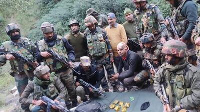 Security forces display the IEDs and ammunition in Ramban on Thursday.
