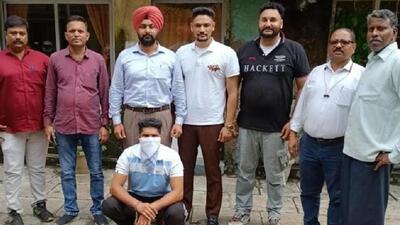 Charat Singh, sitting, the prime accused in the rocket-propelled grenade (RPG) attack on Punjab Police’s intelligence headquarters in Mohali on May 9, in police custody in Mumbai on Thursday. (HT Photo)