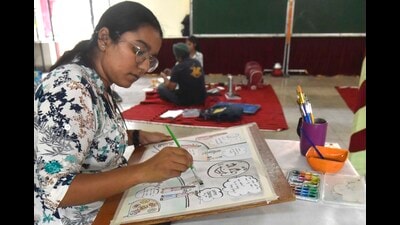 A student participating in the poster-making competition on Day 1 of the 11th Youth festival at Guru Angad Dev Veterinary and Animal Sciences University on Thursday. (Gurpreet SinghHT)