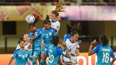 Bhubaneswar: Indian (blue) and USA players in action during their match at FIFA U-17 Women's World Cup 2022 at Kalinga Stadium, in Bhubaneswar (PTI) Bhubaneswar: Indian (blue) and USA players in action during their match at FIFA U-17 Women's World Cup 2022 at Kalinga Stadium, in Bhubaneswar (PTI)