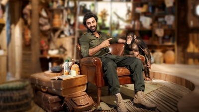 Ranbir Kapoor posing with a chimpanzee in his new pics. Ranbir Kapoor posing with a chimpanzee in his new pics.