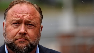 Infowars founder Alex Jones arrives to speak to the media after appearing at his Sandy Hook defamation trial at Connecticut Superior Court in Waterbury, Connecticut, US. (Reuters)