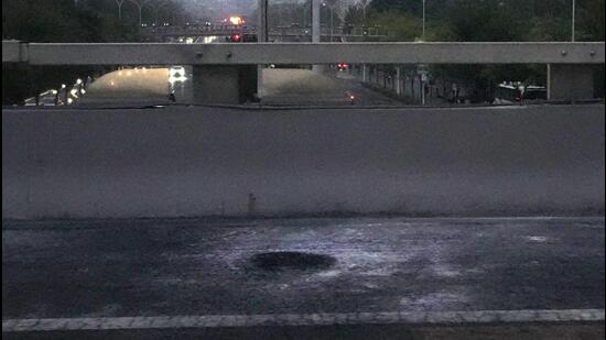 Scorched pavement is seen on the side of a highway overpass near the site where social media videos earlier appeared to show smoke and protest banners in Beijing, on Thursday. (AP)