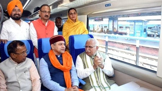 Railways minister Ashwini Vaishnaw and Haryana chief minister Manohar Lal Khattar ride the Delhi-Una Vande Bharat Express.(HT Photo)