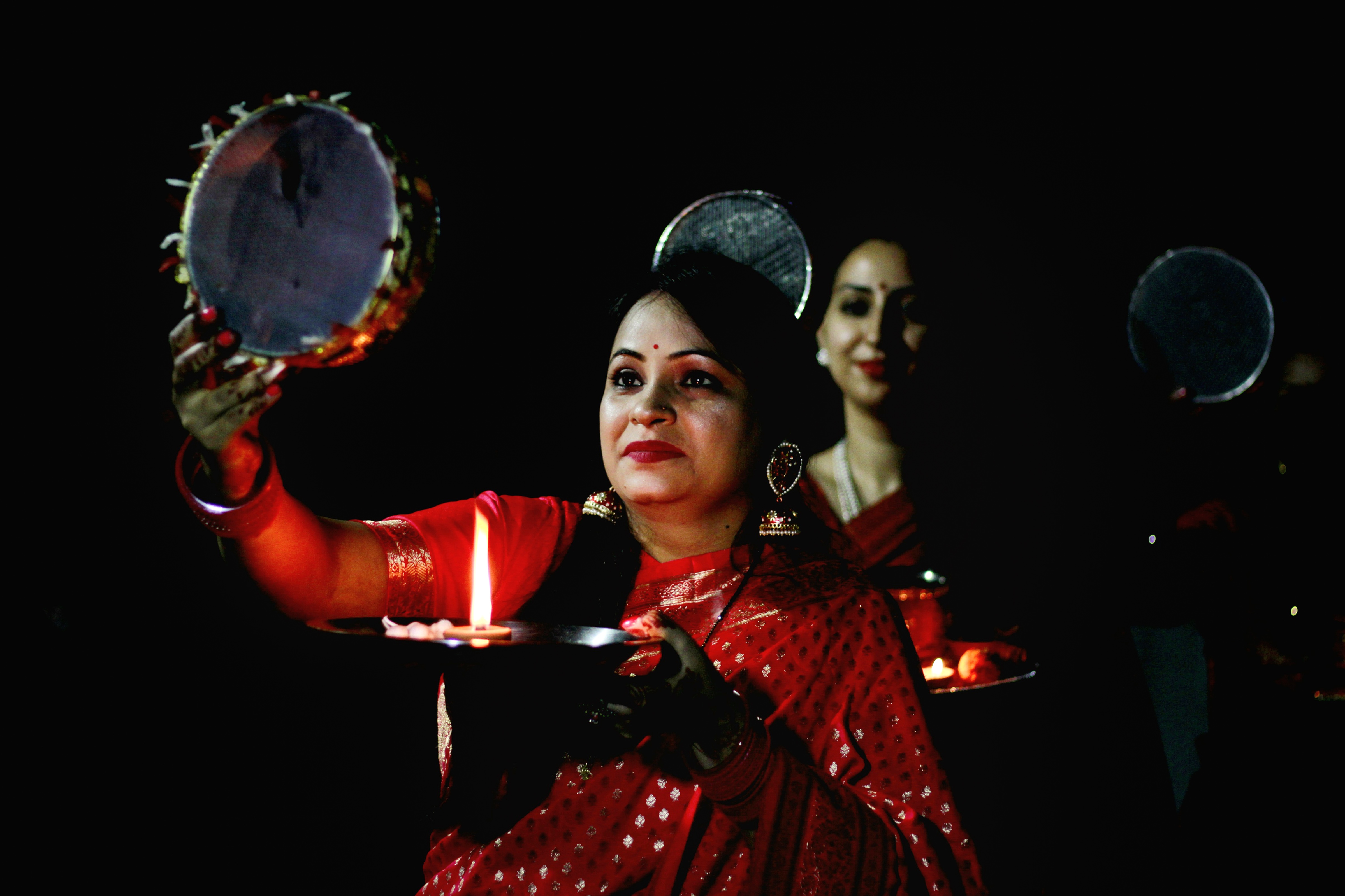 Ghaziabad: Married woman perform rituals celebrating the Karwa Chauth festival, in Ghaziabad, Thursday, Oct. 13, 2022. (PTI Photo)(PTI10_13_2022_000241B) (PTI)