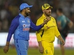 India's captain Rohit Sharma, left, interacts with Australian captain Aaron Finch as they leave the field after the toss India's captain Rohit Sharma, left, interacts with Australian captain Aaron Finch as they leave the field after the toss