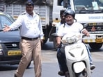To impose a fine on you, the traffic police personnel should carry a challan book or an e-challan machine.(Representative image/HT Photo) To impose a fine on you, the traffic police personnel should carry a challan book or an e-challan machine.(Representative image/HT Photo)