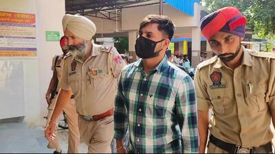 Jagtar Singh, a neighbour of Punjabi singer Sidhu Moose Wala who is an accused in his murder case, being presented in a Mansa court on Friday. (HT Photo)