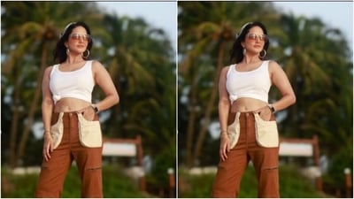 Sunny decked up in a white cropped tank top styled with a knot on the waist, and teamed it with a pair of maroon trousers with multiple pockets and wide legs. (Instagram/@sunnyleone) Sunny decked up in a white cropped tank top styled with a knot on the waist, and teamed it with a pair of maroon trousers with multiple pockets and wide legs. (Instagram/@sunnyleone)