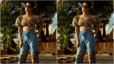 Sunny decked up in a multicoloured cropped top with puff sleeves and teamed it with a pair of blue cotton trousers with a patch of multicolour near the knees. (Instagram/@sunnyleone) Sunny decked up in a multicoloured cropped top with puff sleeves and teamed it with a pair of blue cotton trousers with a patch of multicolour near the knees. (Instagram/@sunnyleone)