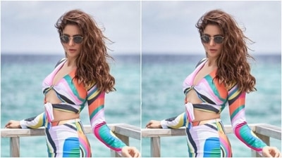 Aamna matched the colours of the sea in the backdrop, as she picked a multicoloured co-ord set and complemented her view. (Instagram/@aamnasharifofficial)