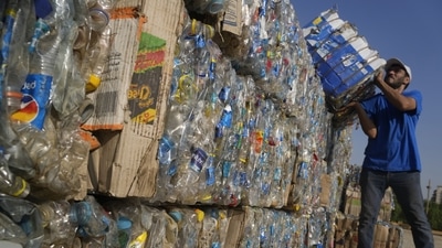"Verynile" initiative worker carries compressed plastic bottles from the Nile to build a Plastic Pyramid ahead of World Cleanup Day in Cairo, Egypt. The pyramid aiming to raise awareness on plastic pollution in the Nile. (AP) "Verynile" initiative worker carries compressed plastic bottles from the Nile to build a Plastic Pyramid ahead of World Cleanup Day in Cairo, Egypt. The pyramid aiming to raise awareness on plastic pollution in the Nile. (AP)