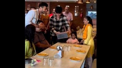The image, taken from the Twitter video, shows the son standing in front of his dad to surprise him on his birthday. (Twitter/@Gulzar_sahab)
