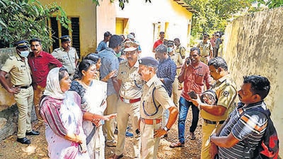 Police and locals at the place where two women were allegedly murdered and buried, in Pathanamthitta district of Kerala. (PTI) Police and locals at the place where two women were allegedly murdered and buried, in Pathanamthitta district of Kerala. (PTI)