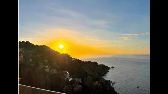 The sunrise in Sicily, which has a blue sea from which the hot, yellow sun, looking a little like a ball of lava itself, rises every morning The sunrise in Sicily, which has a blue sea from which the hot, yellow sun, looking a little like a ball of lava itself, rises every morning