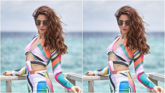 Aamna matched the colours of the sea in the backdrop, as she picked a multicoloured co-ord set and complemented her view.(Instagram/@aamnasharifofficial)