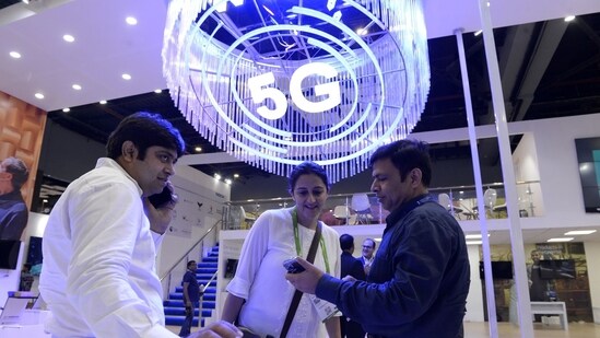 Visitors at India Mobile Congress 2022 exhibition in New Delhi where Narendra Modi, India's prime minister, announced the launch of 5G services in India.(Bloomberg)