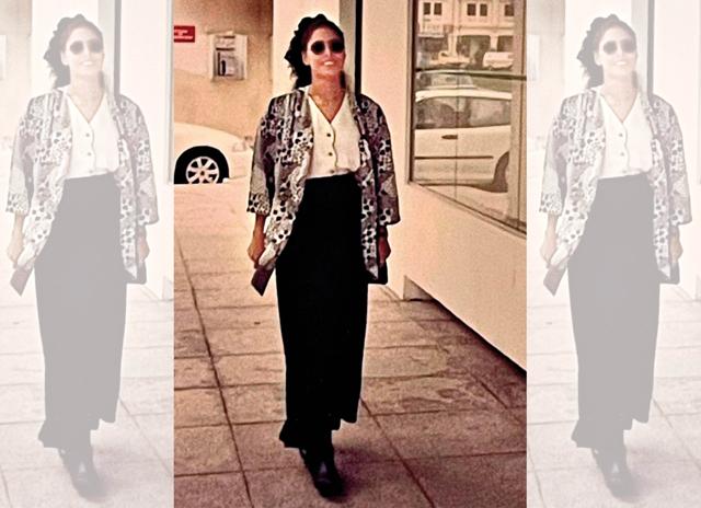 Sporting a layered outfit—parallel pants, tucked-in shirt, loose jacket and boots—while on a trip abroad Sporting a layered outfit—parallel pants, tucked-in shirt, loose jacket and boots—while on a trip abroad