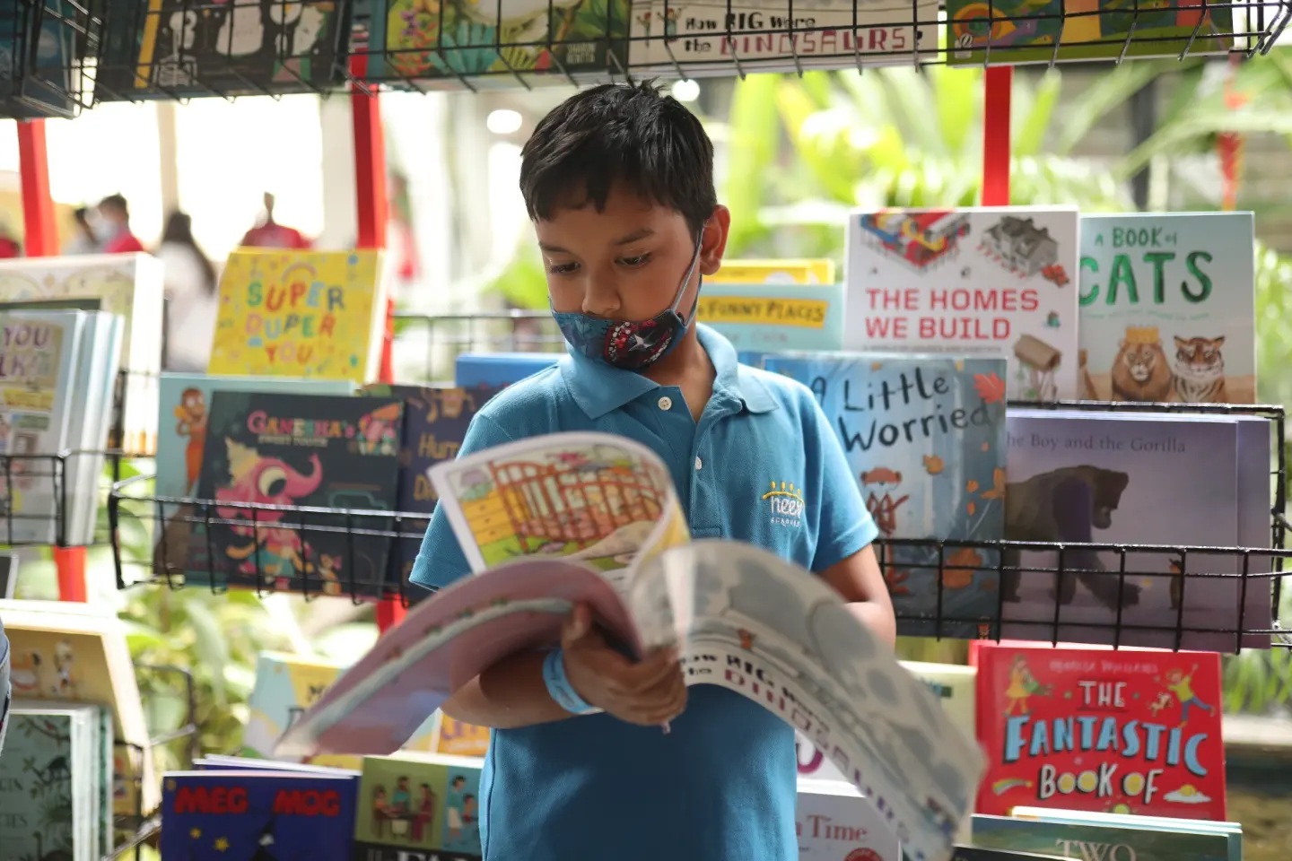 A young reader at the festival’s Sahitya Santhe (Books Marketplace) (Courtesy the Neev Literature Festival) A young reader at the festival’s Sahitya Santhe (Books Marketplace) (Courtesy the Neev Literature Festival)