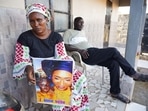 Mariama Kuyateh, 30, holds up a picture of her late son Musawho died from acute kidney failure, in Banjul, (AFP) Mariama Kuyateh, 30, holds up a picture of her late son Musawho died from acute kidney failure, in Banjul, (AFP)