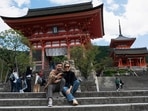 A man and woman pose for a selfie by the entrance of Kiyomizu-dera temple in Kyoto. Japan reopened its doors to tourists on October 11 after two-and-a-half years of tough Covid-19 restrictions, with officials hoping an influx of travellers enticed by a weak yen will boost the economy.&nbsp;