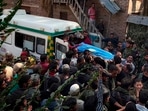 People carry the body of Puran Krishan Bhat in Shopian district on Saturday,