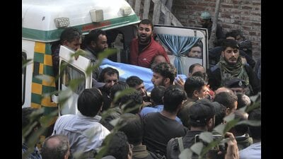 The funeral procession of Puran Krishan Bhat, a Kashmiri Pandit who was shot dead allegedly by terrorists, in the Shopian district of Jammu and Kashmir on Saturday. (PTI) The funeral procession of Puran Krishan Bhat, a Kashmiri Pandit who was shot dead allegedly by terrorists, in the Shopian district of Jammu and Kashmir on Saturday. (PTI)
