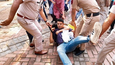 Delhi Police personnel remove AISA activists protesting at the Delhi University’s Arts Faculty. (PTI) Delhi Police personnel remove AISA activists protesting at the Delhi University’s Arts Faculty. (PTI)