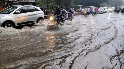 A waterlogged road at Wanowrie on Friday. (Rahul Raut/HT PHOTO)
