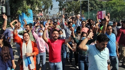 Protesting Kashmiri Pandits raise slogans against terrorists and the administration. (ANI) Protesting Kashmiri Pandits raise slogans against terrorists and the administration. (ANI)