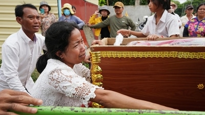 Cambodia Boat Tragedy: Mother of Son Sophat, a teen victim of a boat accident, cries by her daughter's coffin during a funeral procession in Koh Chamroeun village, east of Phnom Penh, Cambodia. (AP) Cambodia Boat Tragedy: Mother of Son Sophat, a teen victim of a boat accident, cries by her daughter's coffin during a funeral procession in Koh Chamroeun village, east of Phnom Penh, Cambodia. (AP)