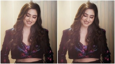 Disha dazzled in a multicoloured cropped top that featured sequin details, full sleeves and a plunging neckline. The cropped top came in patterns in shades of red, purple and black. (Instagram/@dishaparmar) Disha dazzled in a multicoloured cropped top that featured sequin details, full sleeves and a plunging neckline. The cropped top came in patterns in shades of red, purple and black. (Instagram/@dishaparmar)