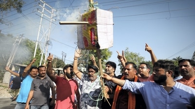Members of the Rashtriya Bajrang Dal burn an effigy during a protest against the killing of Puran Krishan Bhat. (PTI) Members of the Rashtriya Bajrang Dal burn an effigy during a protest against the killing of Puran Krishan Bhat. (PTI)