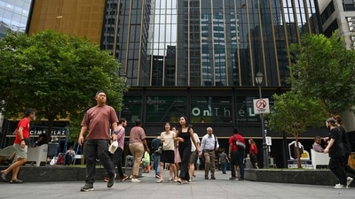 Singapore XBB sub-variant: Office workers walk out for a lunch break at Raffles Place financial business district in Singapore. (AFP) Singapore XBB sub-variant: Office workers walk out for a lunch break at Raffles Place financial business district in Singapore. (AFP)