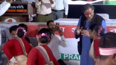 Congress MP Shashi Tharoor dancing with folk dancers performing Bihu dance in Guwahati, Assam. (ANI) Congress MP Shashi Tharoor dancing with folk dancers performing Bihu dance in Guwahati, Assam. (ANI)